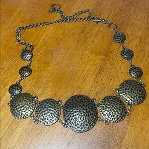 Hammered pewter graduated disc adjustable length metal fashion belt.  Vintage